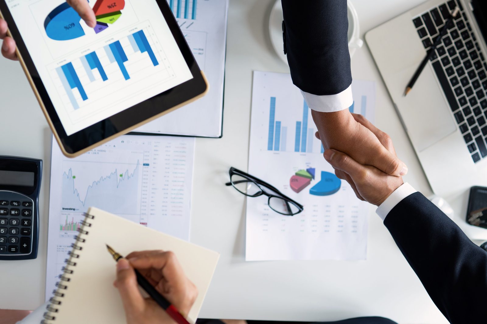 Reviewing charts and plans side by side to compare energy suppliers